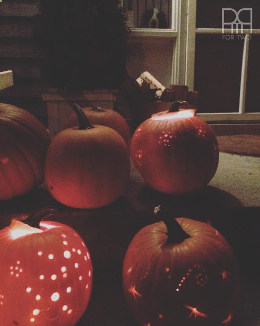 drilled pumpkin gathered on steps