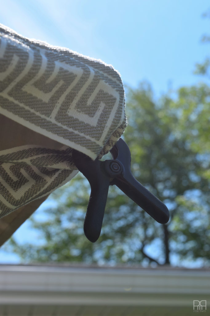 Painting Patio Umbrella with clamps holding it