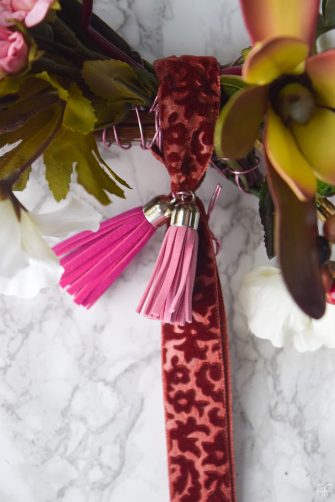 close-up of tassels and ribbon on a wreath