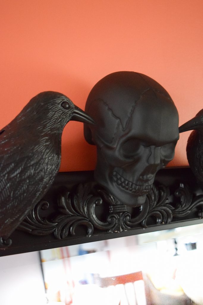 Create a show-stopping piece of Halloween Decor for your entryway using items from the dollar store and an existing mirror