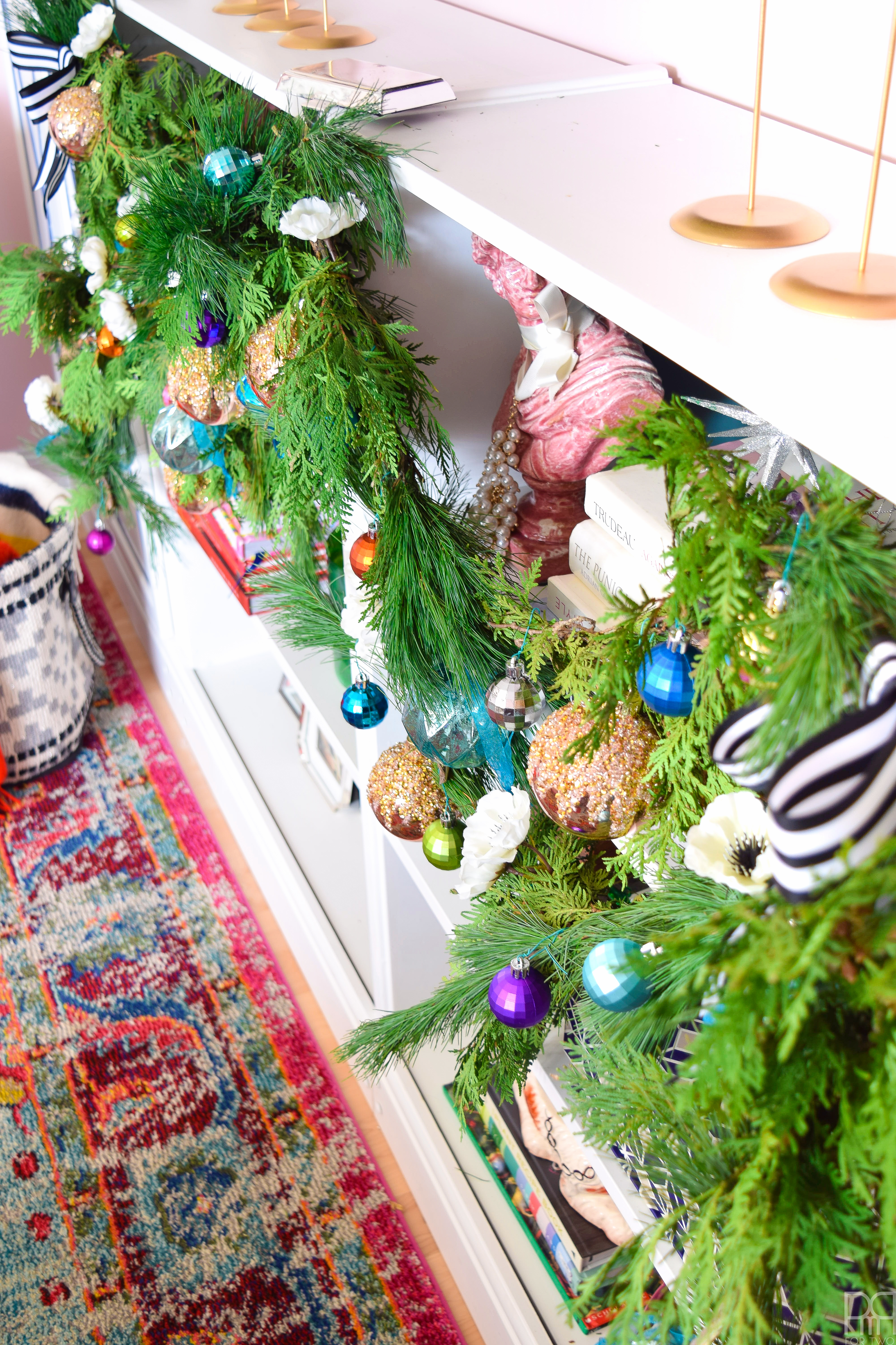 Creating a colourful & Eclectic Holiday Mantel is as easy with fresh greenery, florals and colourful baubles.