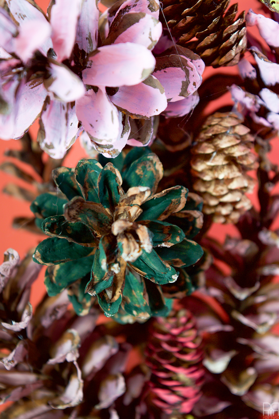 I painted pinecones in beautiful on-trend hues, and gluing them to a wreath - easy as 1-2-3!