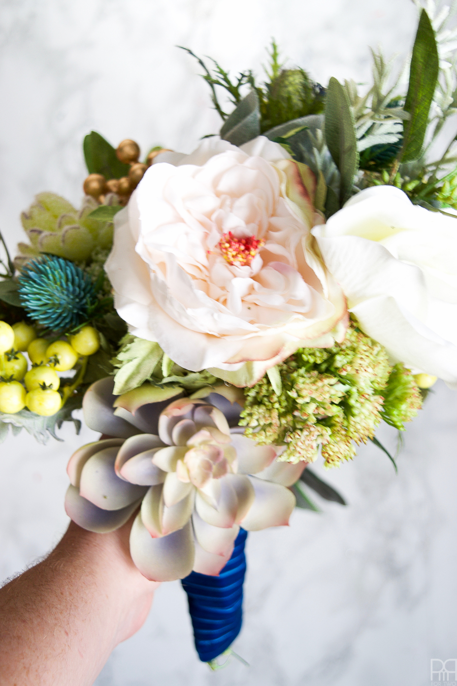 I made a winter wedding bouquet using greens, pinks, and subtle shades of blue. Perfect for any winter nuptials!