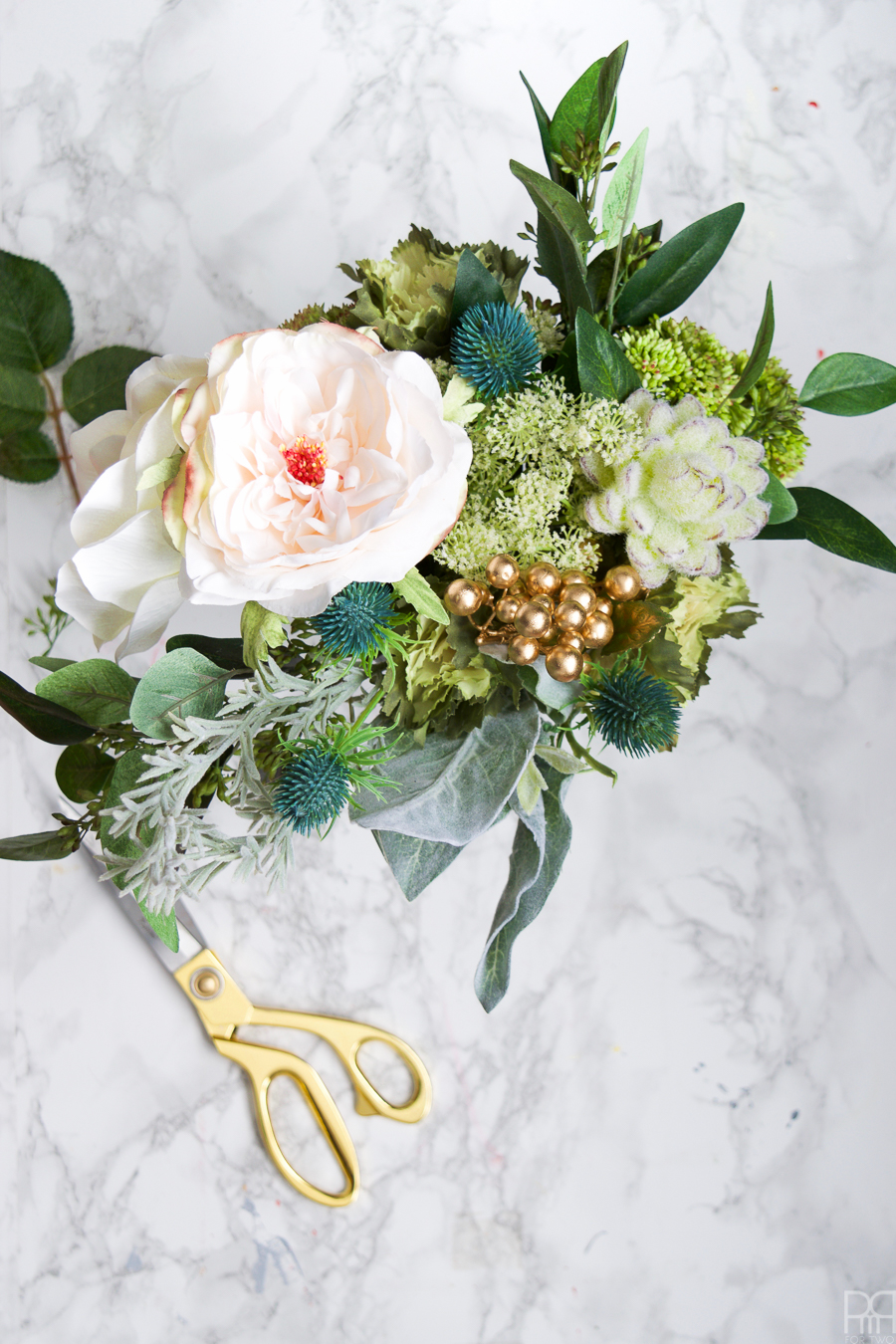 I made a winter wedding bouquet using greens, pinks, and subtle shades of blue. Perfect for any winter nuptials!