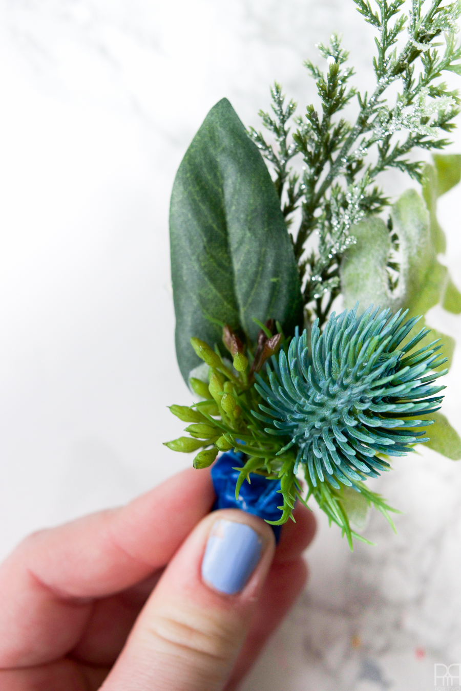 Make your own Winter Wedding Boutonnieres in under 4 minutes with these beautiful silk florals.