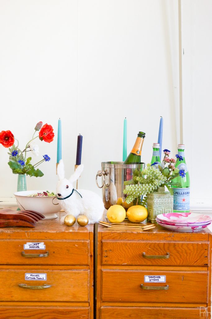 Using Krylon Spray Paint I created a colourful tablecloth at the centre of my eclectic & colourful easter table decor. Florals, bunnies and more abound in this colourful tablescape.