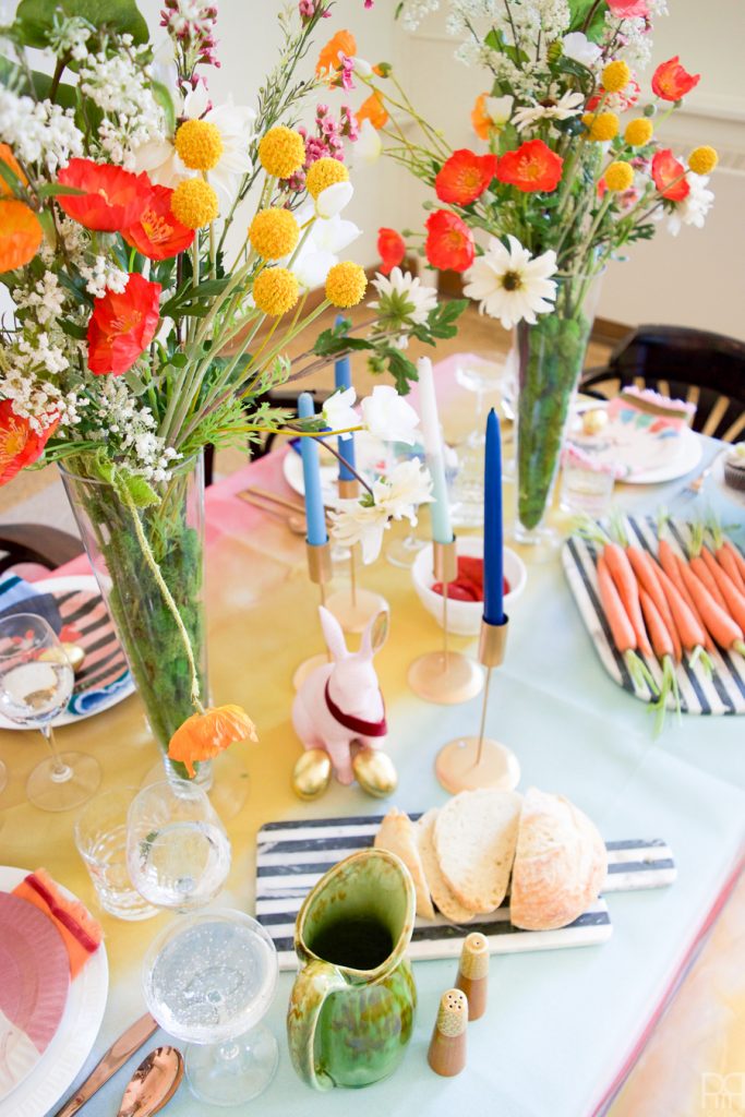 Using Krylon Spray Paint I created a colourful tablecloth at the centre of my eclectic & colourful easter table decor. Florals, bunnies and more abound in this colourful tablescape.