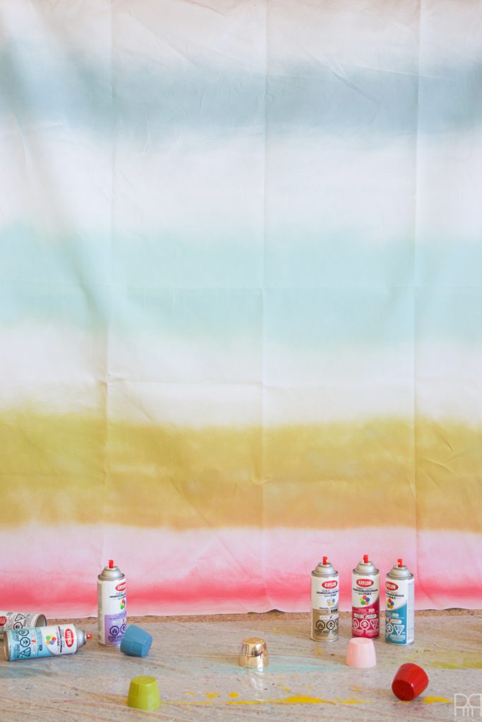 Using Krylon Spray Paint I created a colourful tablecloth at the centre of my eclectic & colourful easter table decor. Florals, bunnies and more abound in this colourful tablescape.