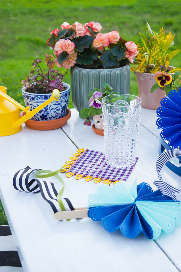 Using my Cricut Explore Air 2 and some colourful card stock and ribbons, I made beautifully paper fans for summer entertaining and outdoor living. Come see how you can make a set for yourself!