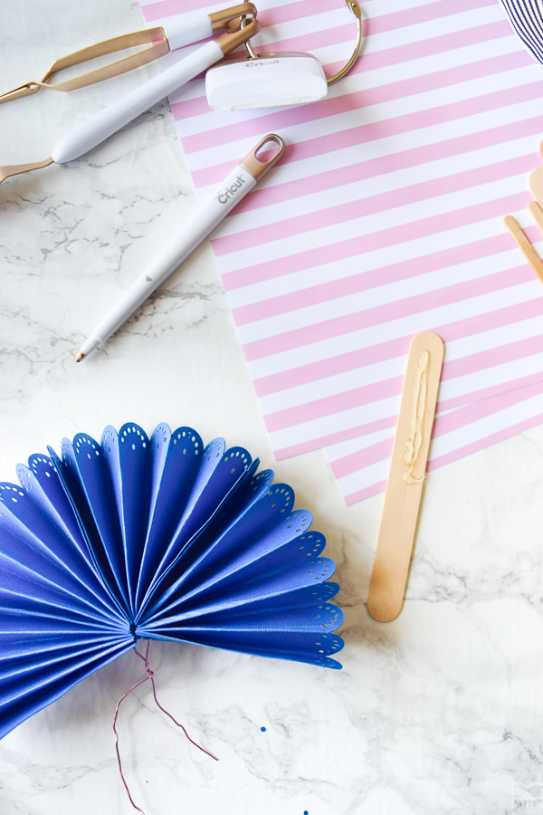 Using my Cricut Explore Air 2 and some colourful card stock and ribbons, I made beautifully paper fans for summer entertaining and outdoor living. Come see how you can make a set for yourself!