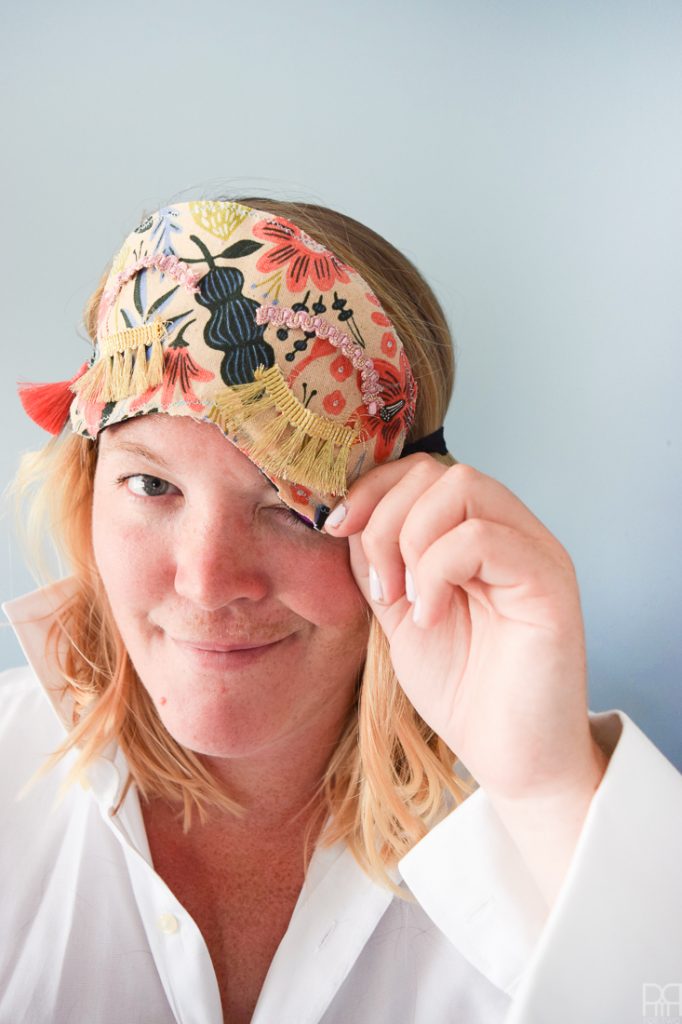 Make your own DIY Holly Golitghtly Sleep Masks with the supplies you may already have. Colourful tassels and pom poms, fringe, and fabric scraps are all you need for these fun sleep masks that would also make a great gift.