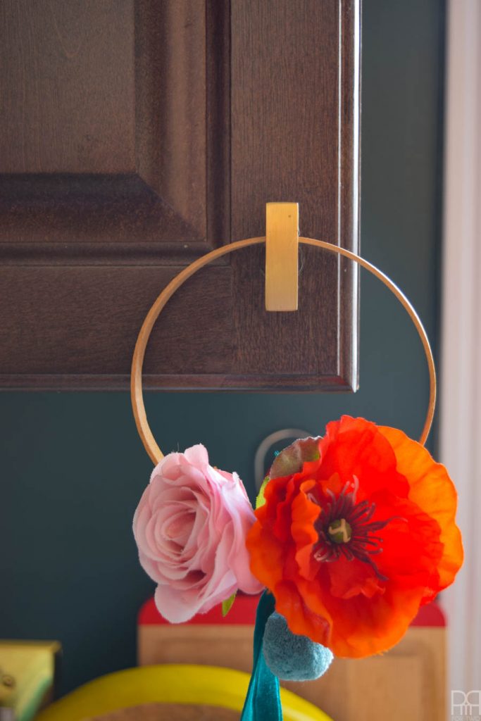 mini hoop wreath on a cupboard knob