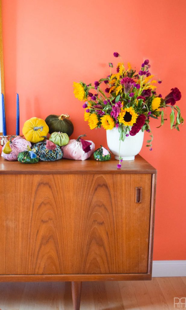 fabric pumpkins on an mcm sideboard