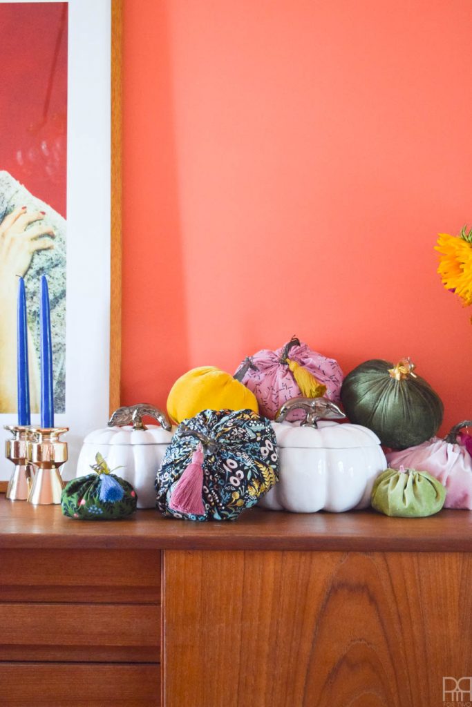 DIY colourful fabric pumpkins on a teak sideboard