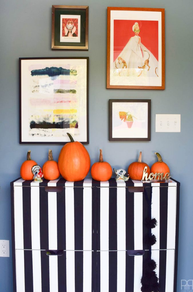 fall entryway with black and white stripped dresser