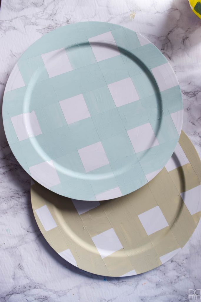 Using Americana's chalky finish paint you can cover-up ugly plastic plates and create beautiful painted plaid chargers.