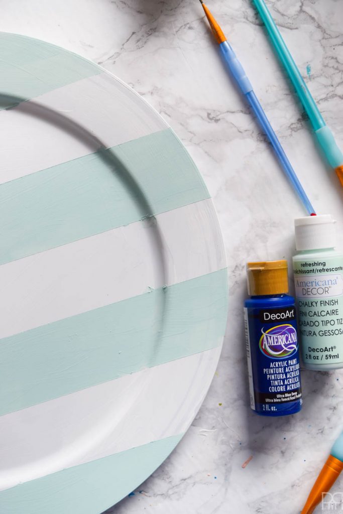 Using Americana's chalky finish paint you can cover-up ugly plastic plates and create beautiful painted plaid chargers.