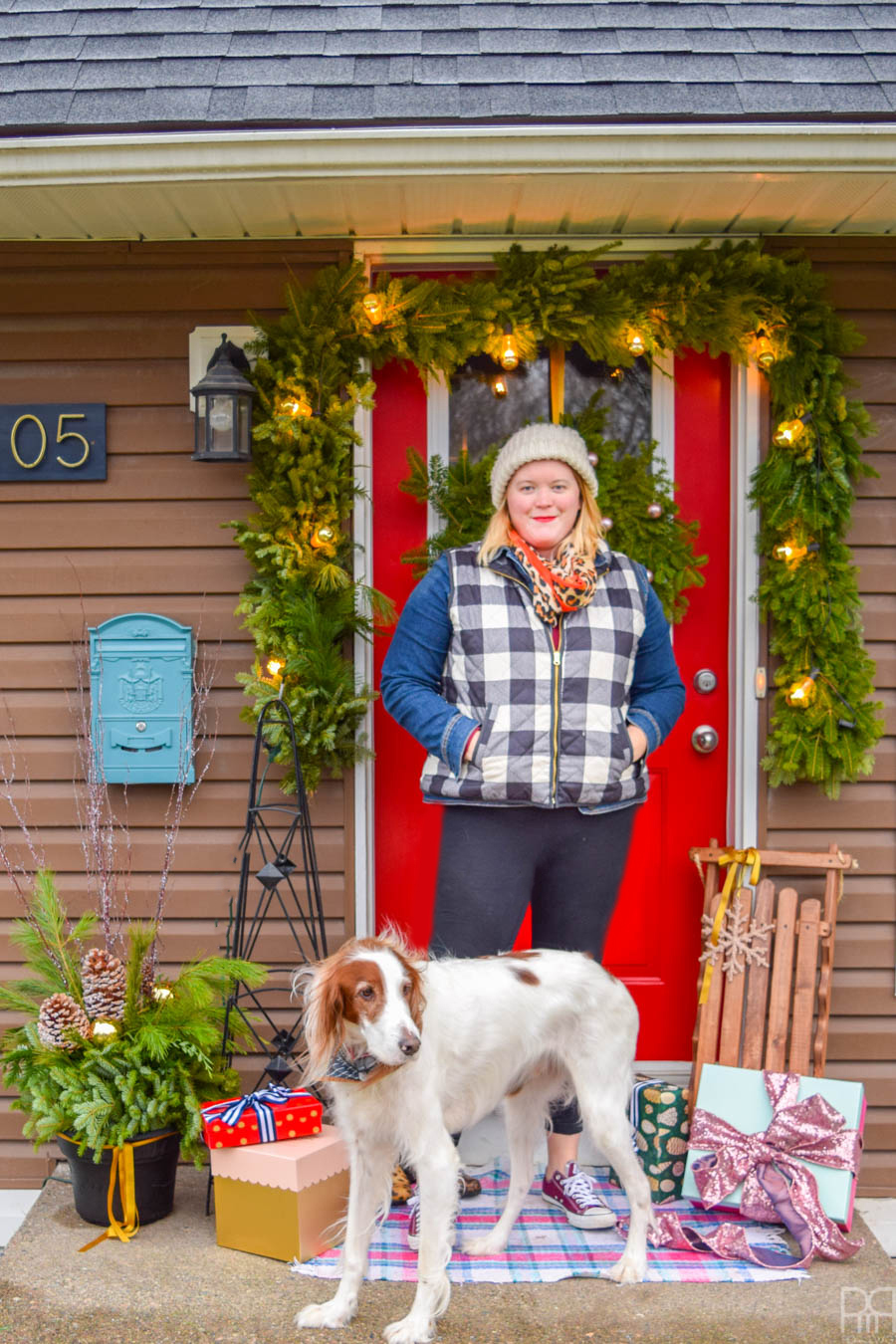 We're off to a good start over here with my colourful Christmas front porch. A bright red door and Yuletide greenery are the perfect touch. #curbappeal #christmasporch #homefortheholidays 