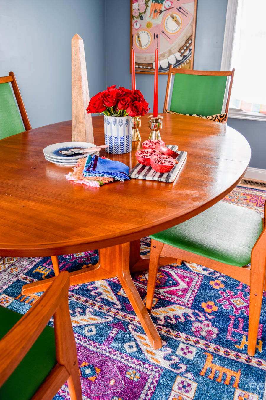 A fresh coat of paint, some cute and colourful art, well placed accessories, and of course - kick-ass furniture. That's how this ORC came together. My MCM dining room table and sideboard never looked so good!