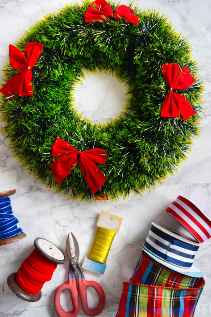 Instead of a generic store bought wreath, make a set with personal significance using your favourite ornaments and a little bit of ribbon. #maximalistdecor #christmasdecor #christmascraft #chrismastwreath #ornamentwreath