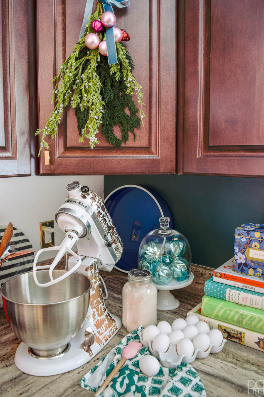 Create perfect Juniper Berry Christmas Swags using Afloral stems and ornaments. They're the perfect decor for your kitchen or bathroom, and don't take up as much room as a wreath.