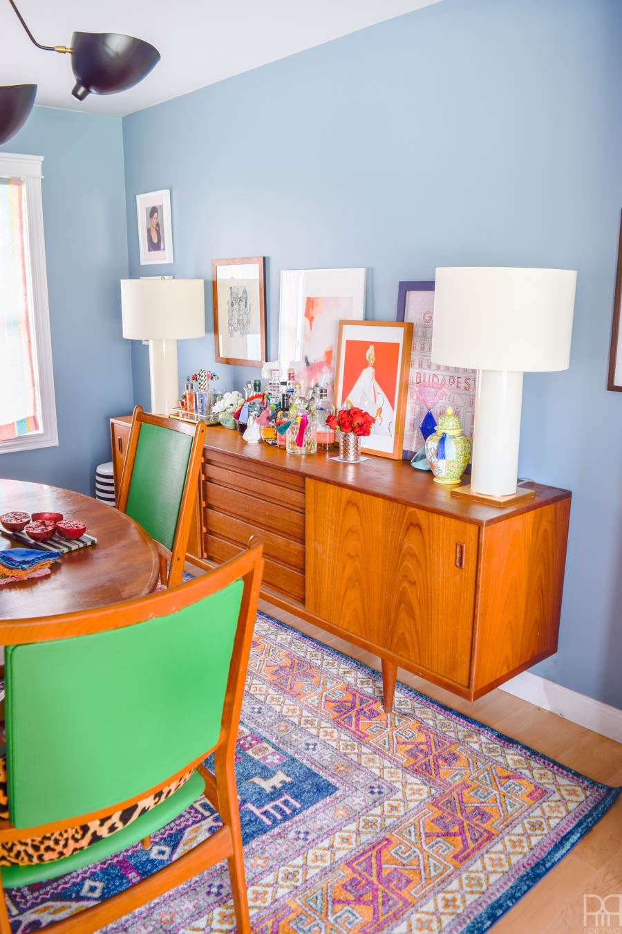 A fresh coat of paint, some cute and colourful art, well placed accessories, and of course - kick-ass furniture. That's how this ORC came together. My MCM dining room table and sideboard never looked so good!