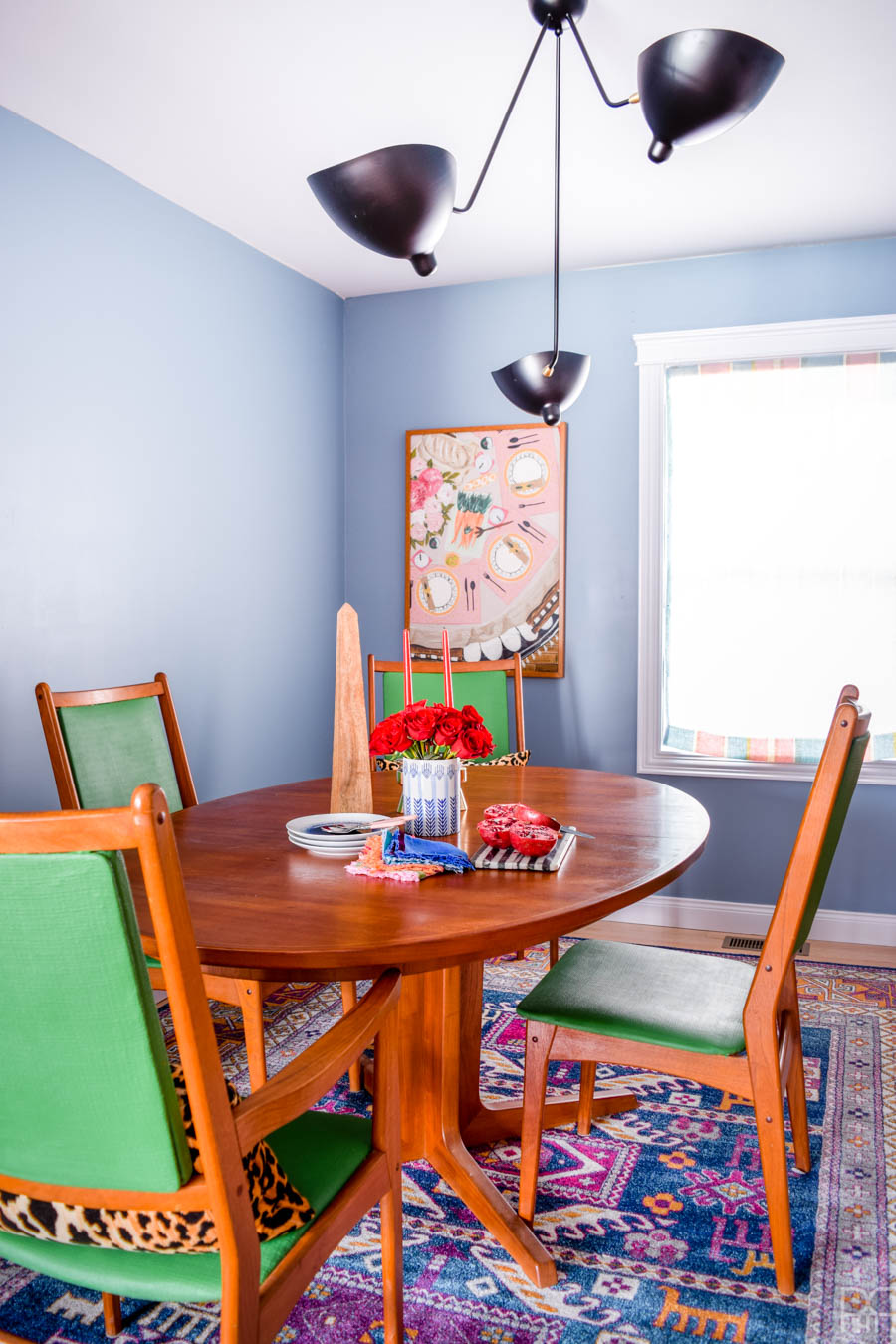 A fresh coat of paint, some cute and colourful art, well placed accessories, and of course - kick-ass furniture. That's how this ORC came together. My MCM dining room table and sideboard never looked so good!