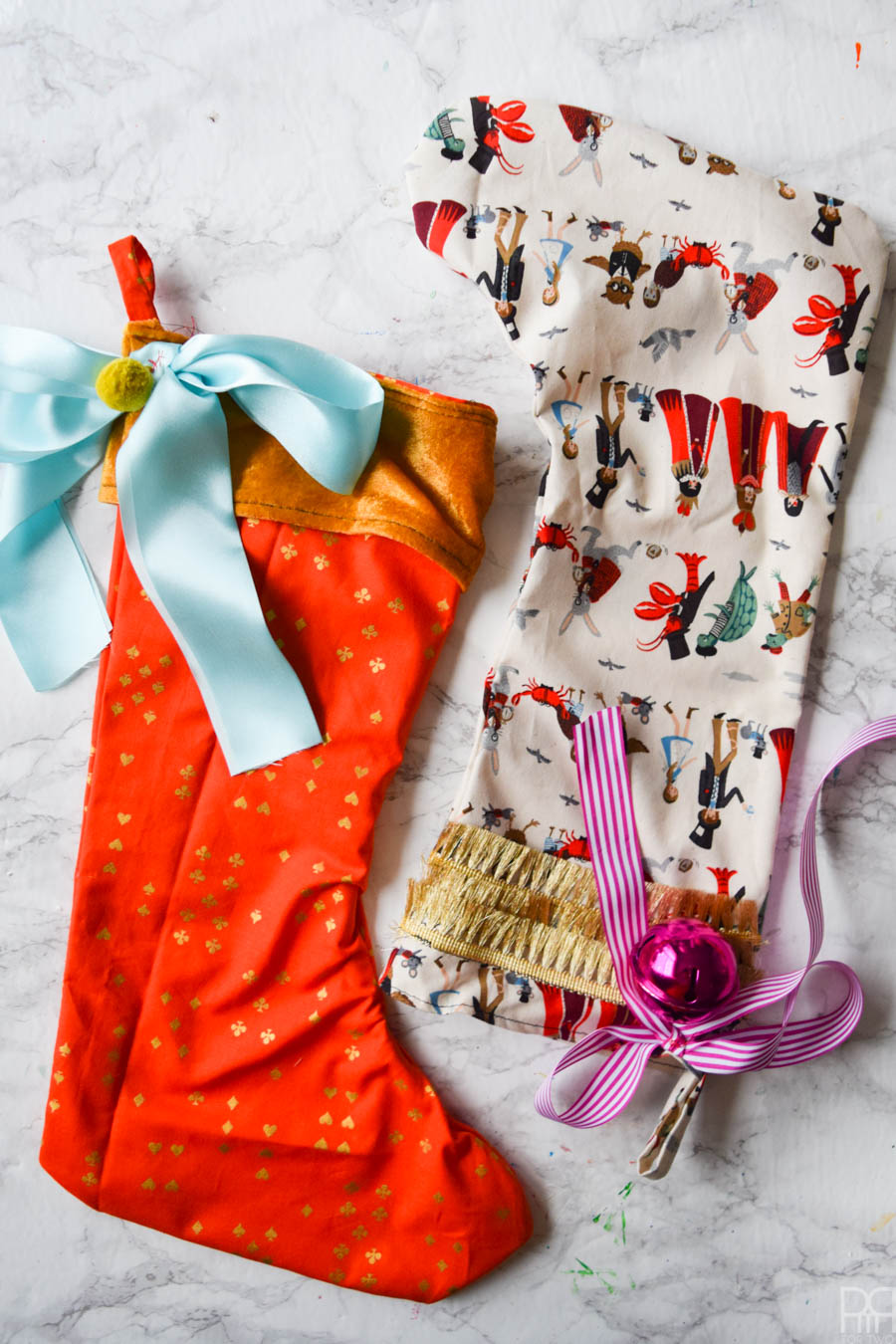 DIY Colourful Christmas Stockings are exactly what you need to kick it up a notch with your deco situation this year. Colourful fabric and vibrant trims create bold, show stopping accents.