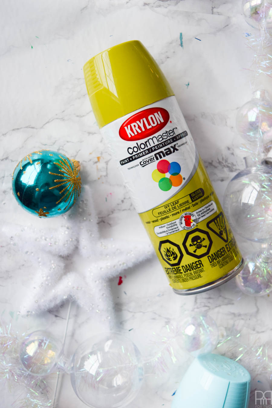 Spend an afternoon creating the perfect Christmas garland using old ornaments and some Krylon spray paint for a beautifully dusted look. Unicorns do exist y'all, and this garland is proof. #krylon #spraypaint