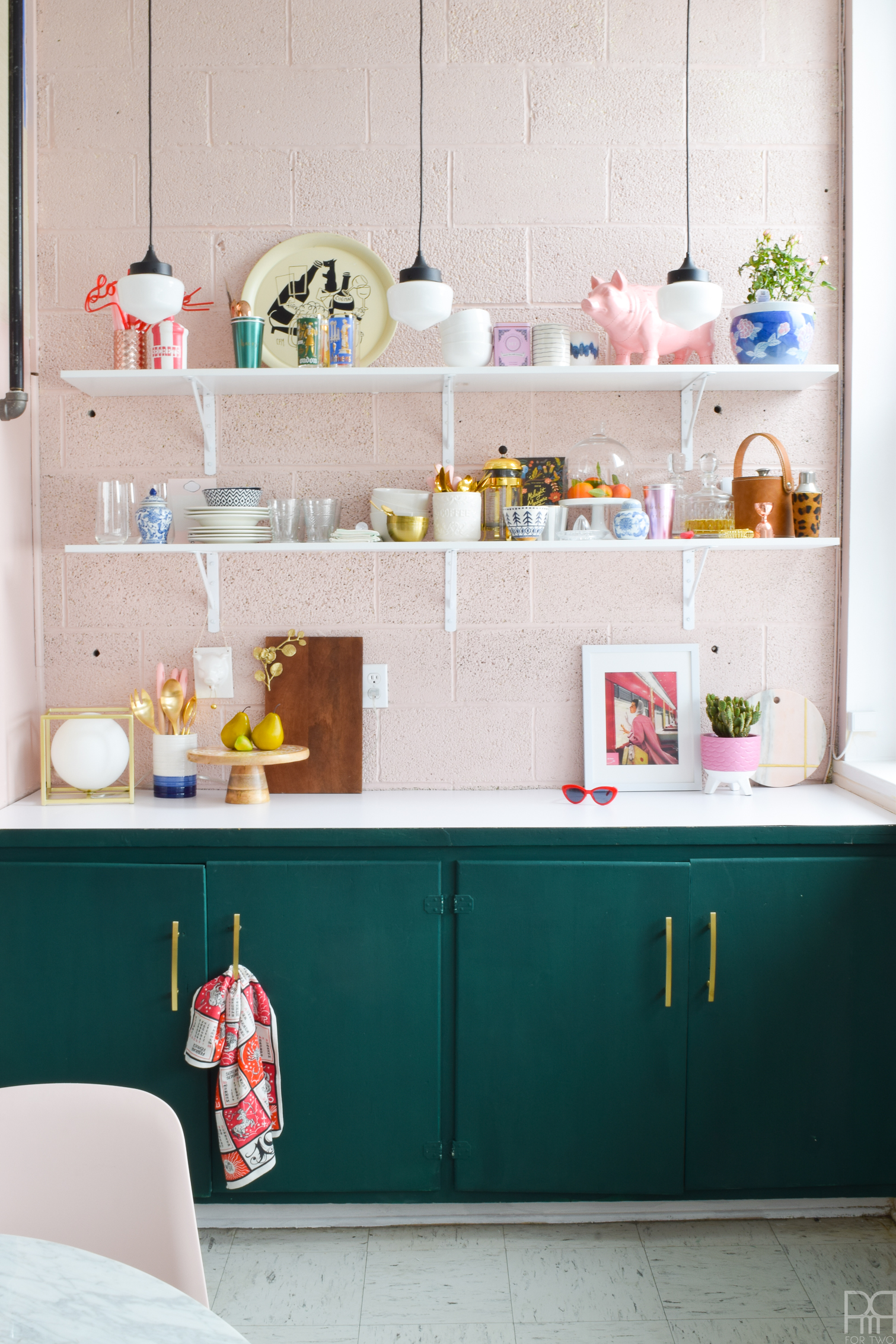 The eclectic & bold kitchen makeover to end all rental kitchen makeovers. Come see how we transformed this space using paint and well curated accessories. FAT Paint's Cascadia green & BEHR's Bella Mia truly get to shine in this makeover.