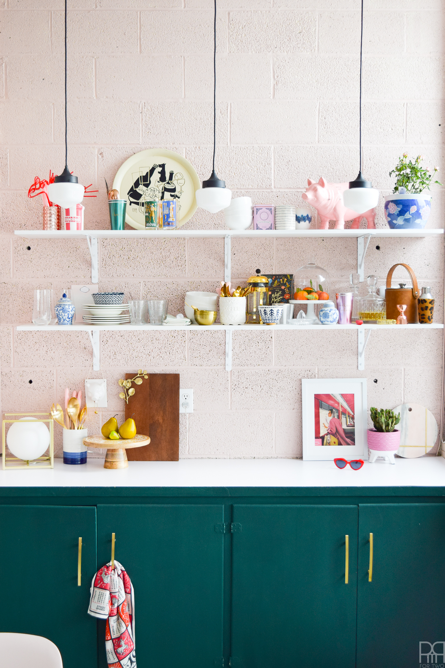 The eclectic & bold kitchen makeover to end all rental kitchen makeovers. Come see how we transformed this space using paint and well curated accessories. FAT Paint's Cascadia green & BEHR's Bella Mia truly get to shine in this makeover.