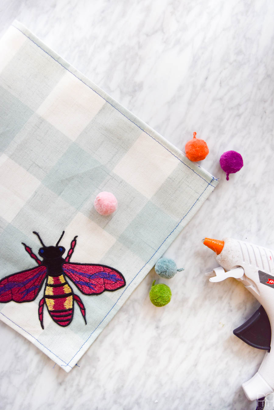 Inspired by the hit runway fashion trend, these DIY Gucci Inspired Tea Towels are easier to make than you'd think! Grab some fun fabric prints and these affordable iron-on patches, and you're ready to go!