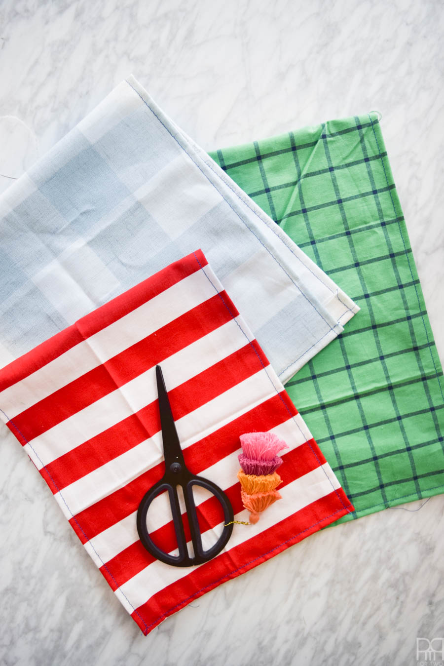 Inspired by the hit runway fashion trend, these DIY Gucci Inspired Tea Towels are easier to make than you'd think! Grab some fun fabric prints and these affordable iron-on patches, and you're ready to go!