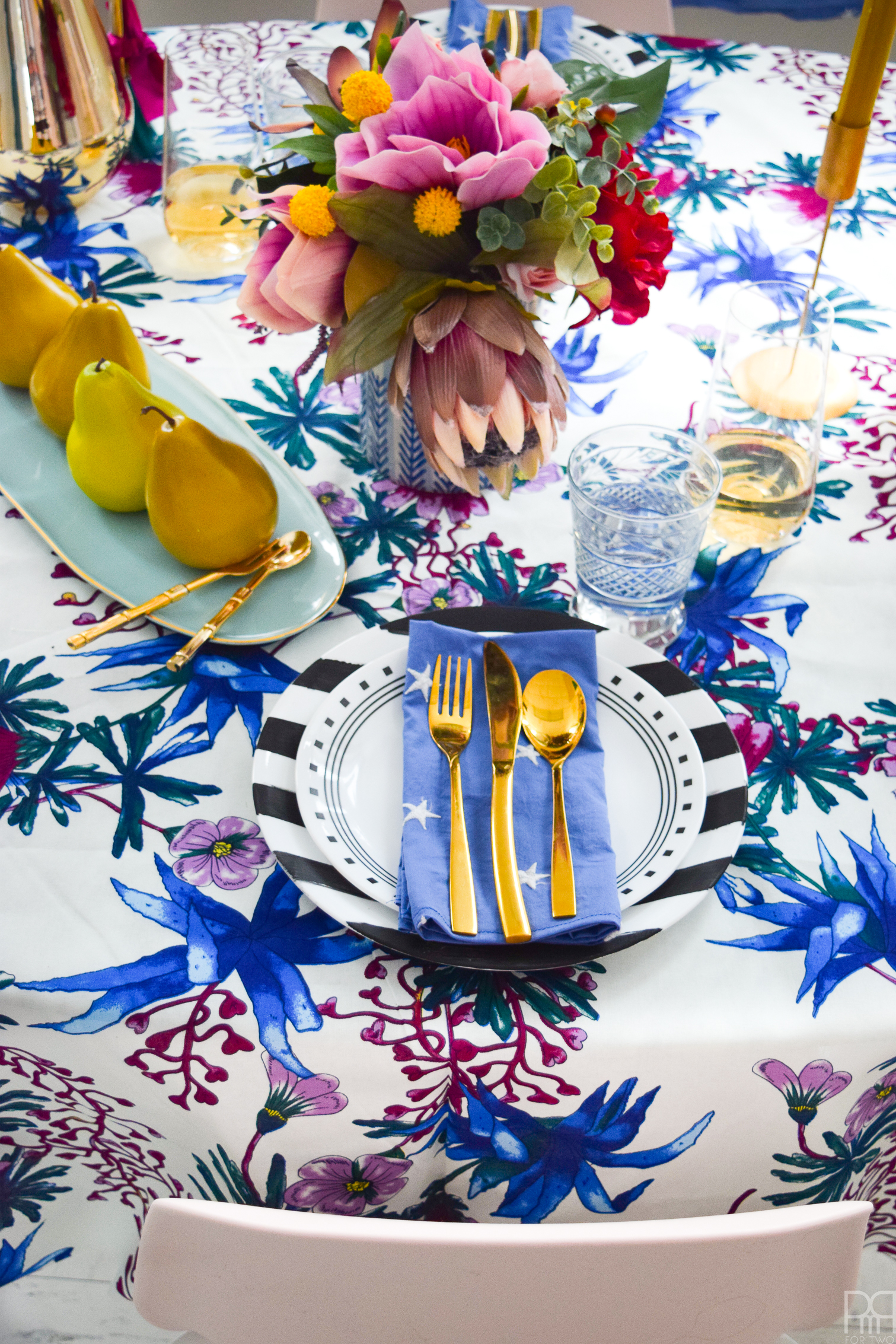 A Blue Valentine Romantic Tablescape for those of us who don't celebrate Valentine's day in a traditional way. Lush florals, rich purples and royal blues are what makes this place setting unique.