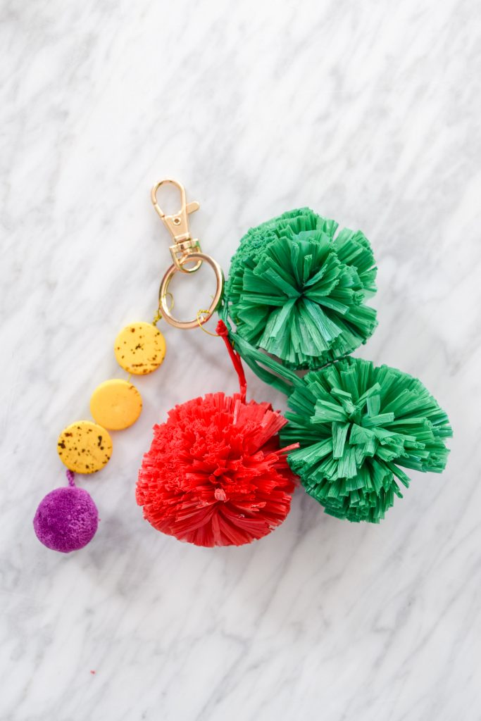 My gucci inspired straw clutch cost me a grand total of about 20$, took less than an hour to make, and is going to be an absolute hit this summer. So what are you waiting for? Get your hands on some raffia pom poms and paint.