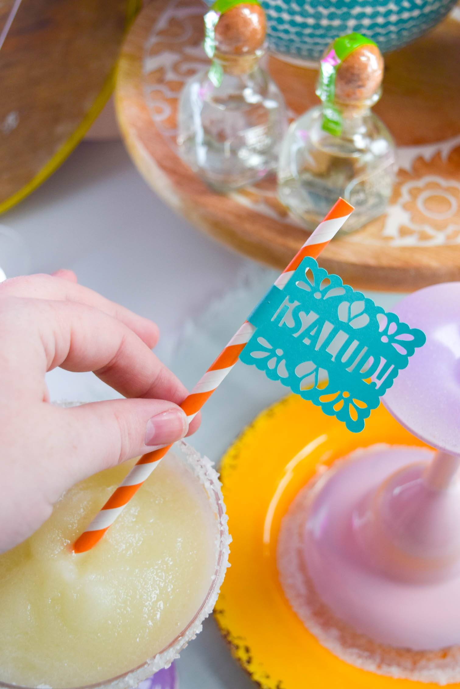 DIY Ombre Margarita Glasses (and margaritas!) to help you get your drank on. All you need is Krylon spray paint and some miss-matched glasses from the thrift store.