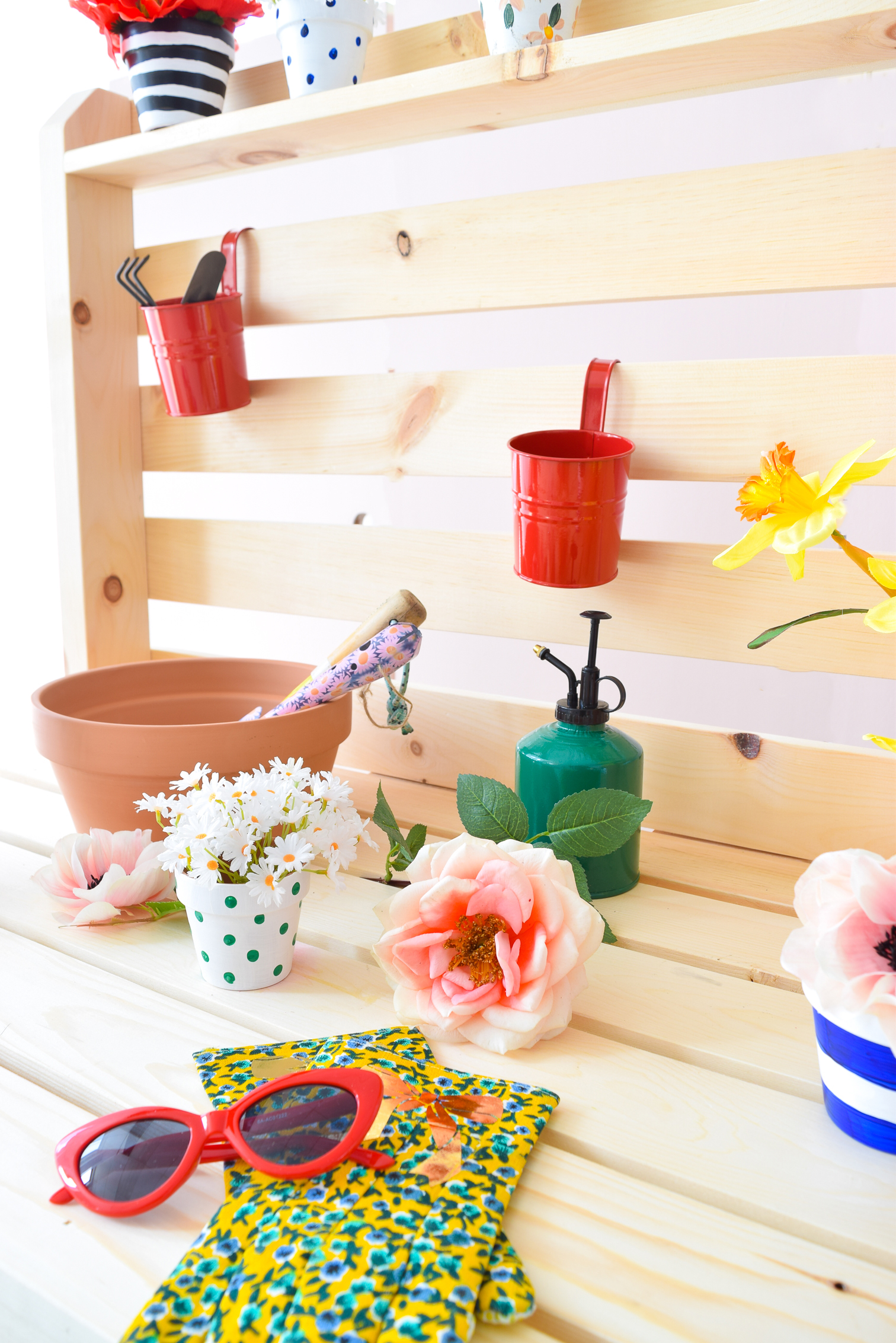 Get your build on with a DIY Potting Bench - perfect for spring and summer's blooming florals! PLUS, you can make it for under $200 and under 2hrs.