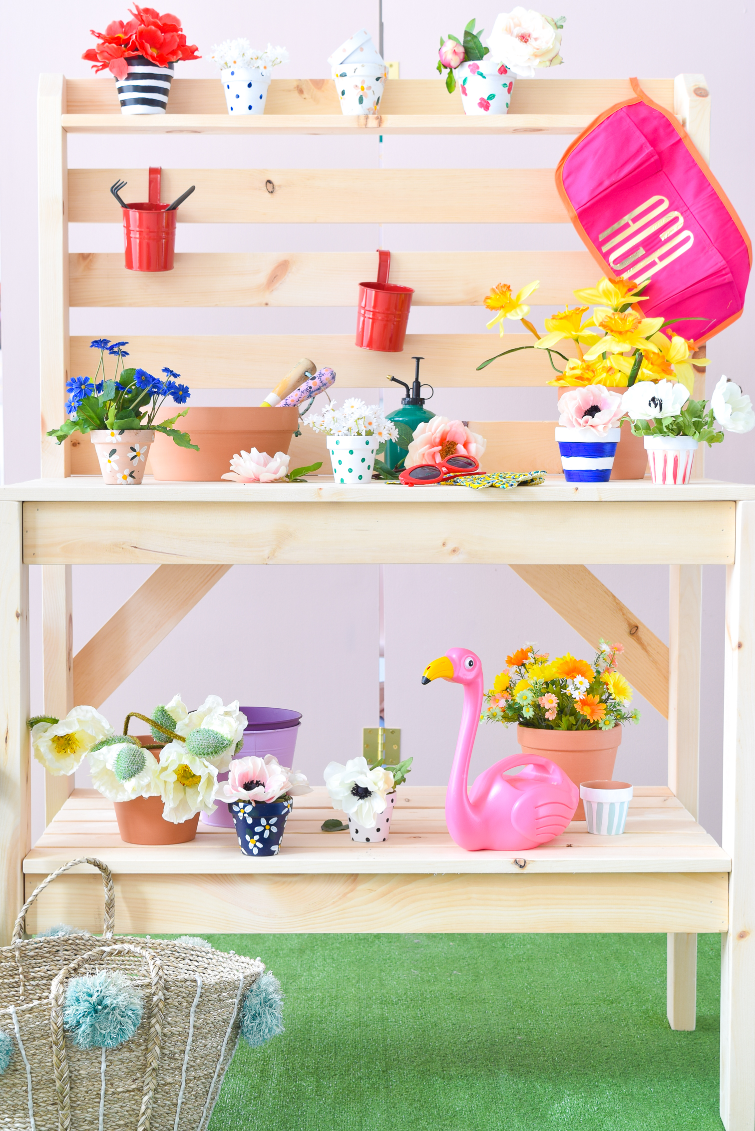 Get your build on with a DIY Potting Bench - perfect for spring and summer's blooming florals! PLUS, you can make it for under $200 and under 2hrs.