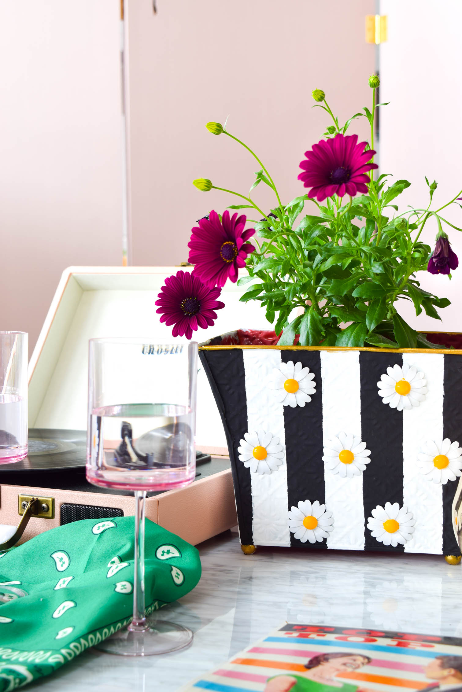 My mod DIY striped daisy planter is not only bold, but super retro, and lots of fun. All you need is paint and some fun metallic flowers. Grab all the deets on the blog!