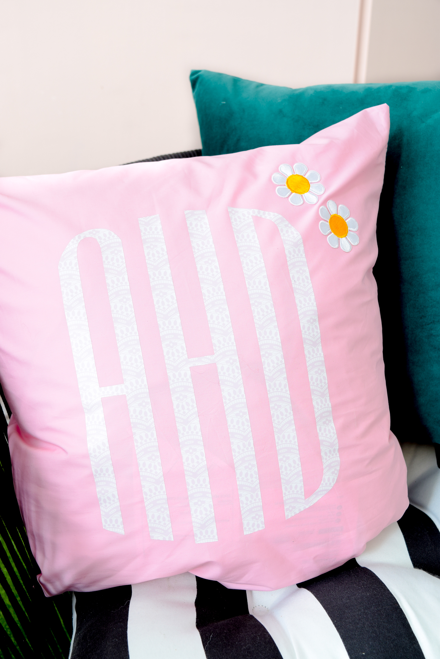 Patterned Iron on Monogram Pillows are where it is at this season. Get your hands on Cricut's new pattern samplers, and create some funky, retro cool pillows for your home now.