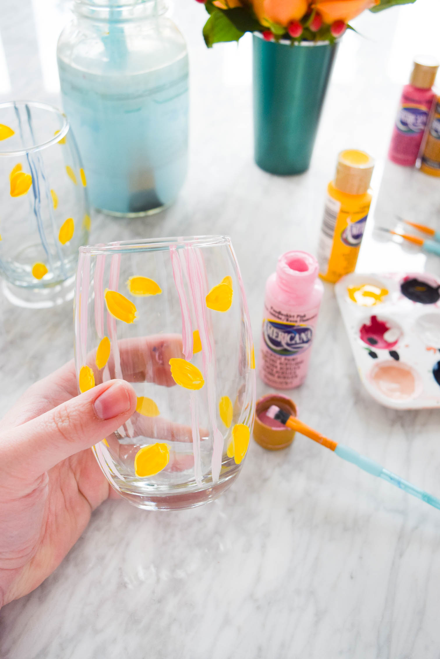 My DIY Painted Plaid & Lemon Glasses are the cutest thing you'll see all day. You can make your own summer drinkware with a retro and fun vibe, in just an afternoon.