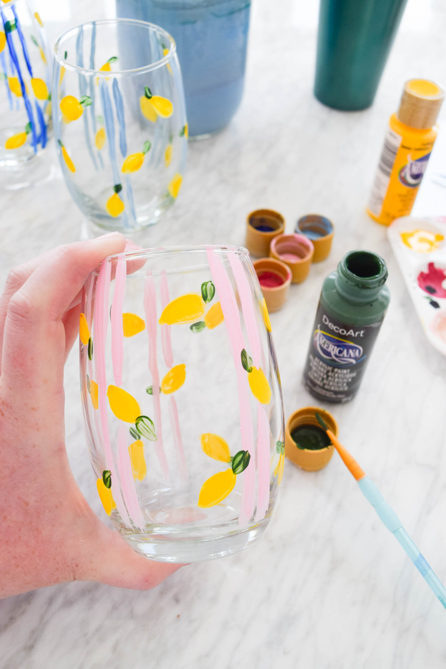 My DIY Painted Plaid & Lemon Glasses are the cutest thing you'll see all day. You can make your own summer drinkware with a retro and fun vibe, in just an afternoon.