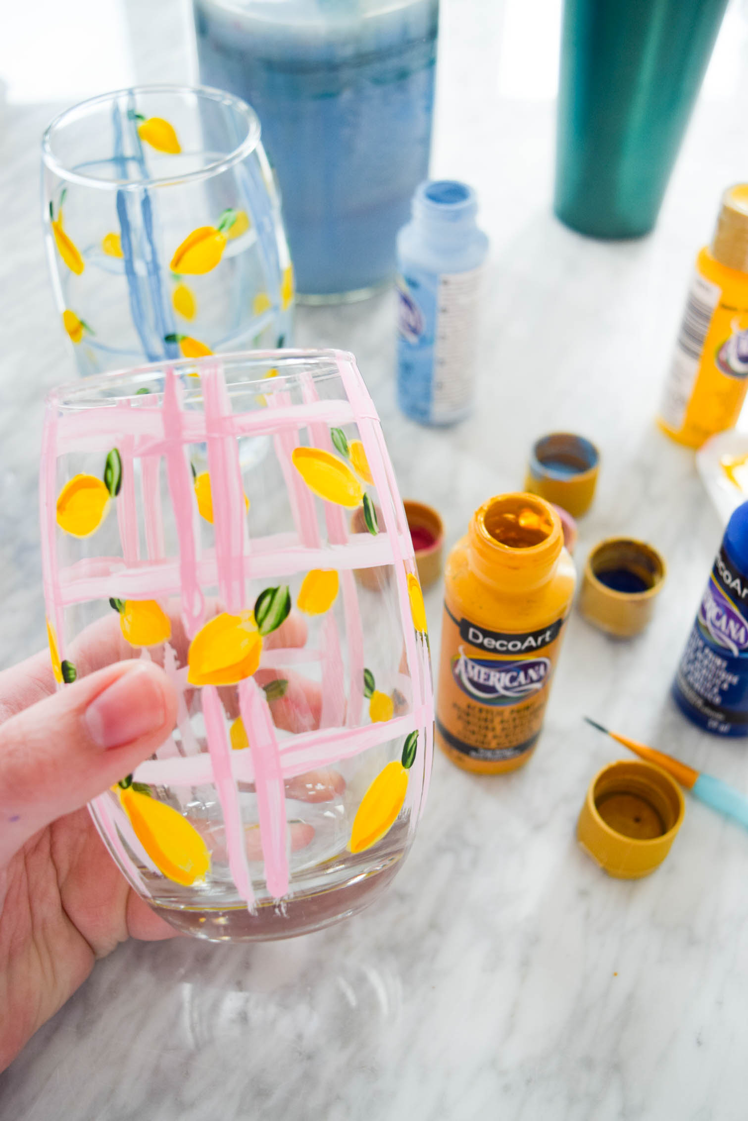 My DIY Painted Plaid & Lemon Glasses are the cutest thing you'll see all day. You can make your own summer drinkware with a retro and fun vibe, in just an afternoon.