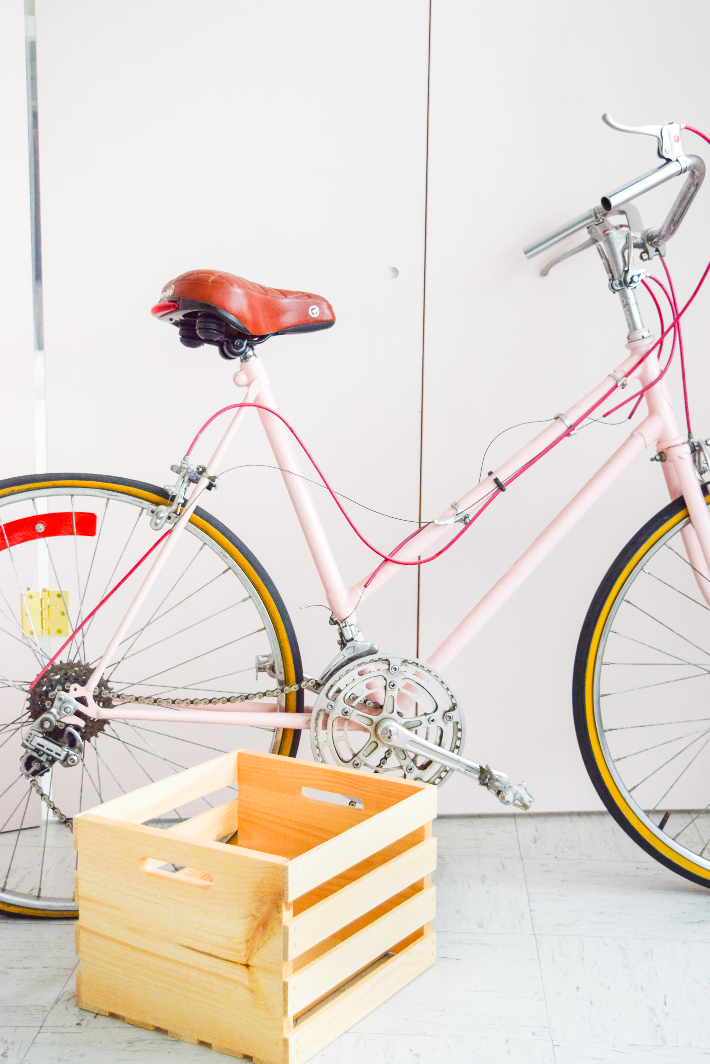 Get your summer bike situation sorted with this DIY Bike Picnic Crate. I transformed a wooden crate using some wood stain, paint and old belts! You can do the same too, just come grab the deets.