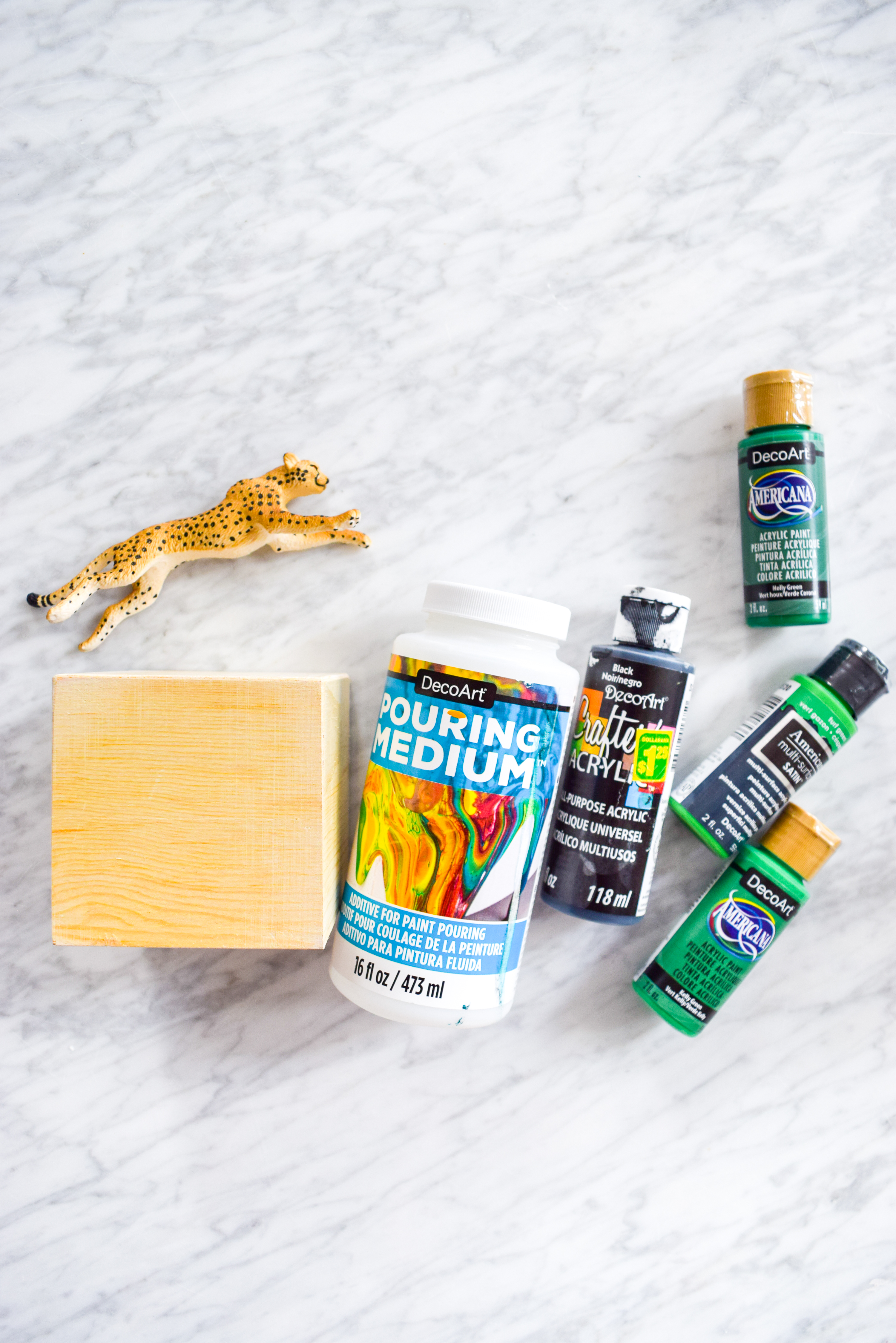 DIY Malachite & Cheetah Decor on a budget! Because who really has the coins for some malachite? Grab the secrets behind this paint pouring DIY.