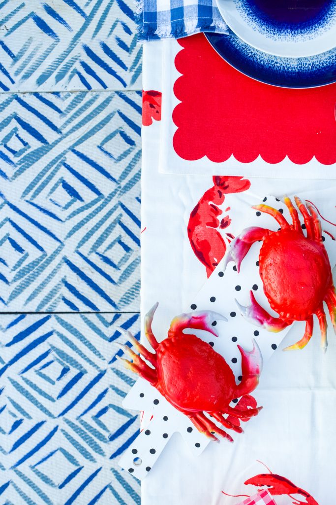 patterned floor tiles with crabs on table above