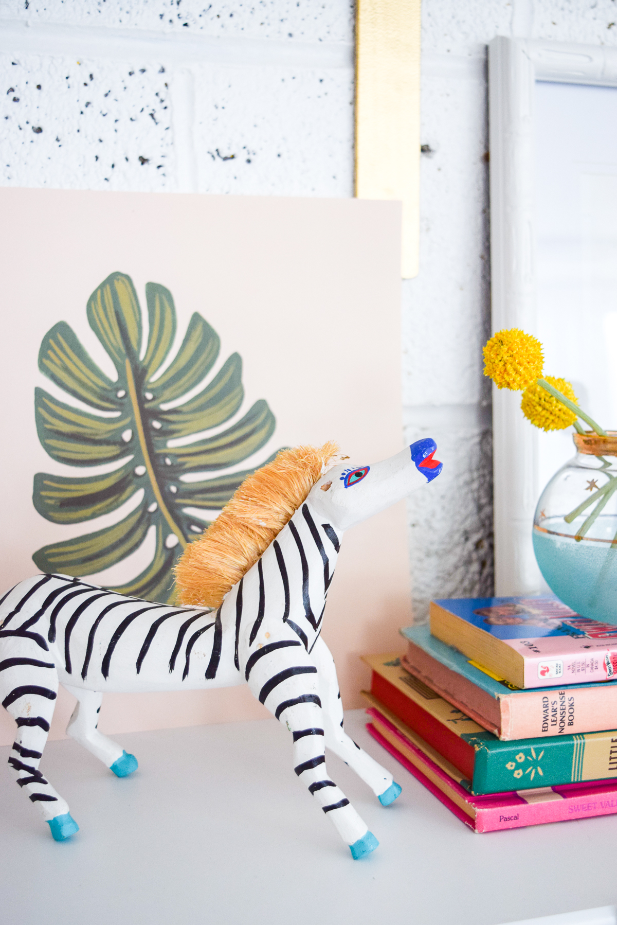 Who would have thought that gold shelf brackets would have kicked-off a pink & gold office revamp? Full of bright colours, gold, playful touches and accessories from women owned stores, what's not to love? handmade wooden zebra on a shelf