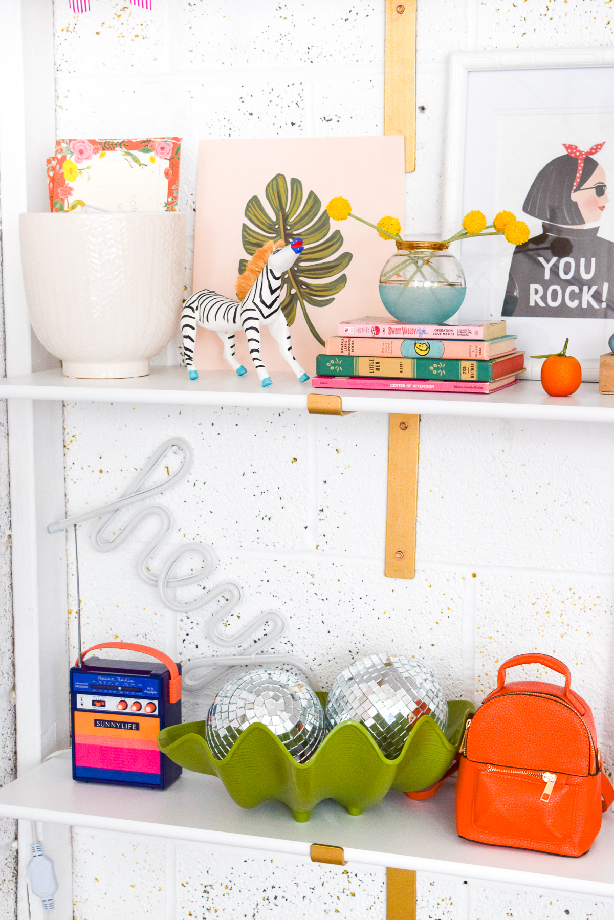 Who would have thought that gold shelf brackets would have kicked-off a pink & gold office revamp? Full of bright colours, gold, playful touches and accessories from women owned stores, what's not to love? decorated shelves