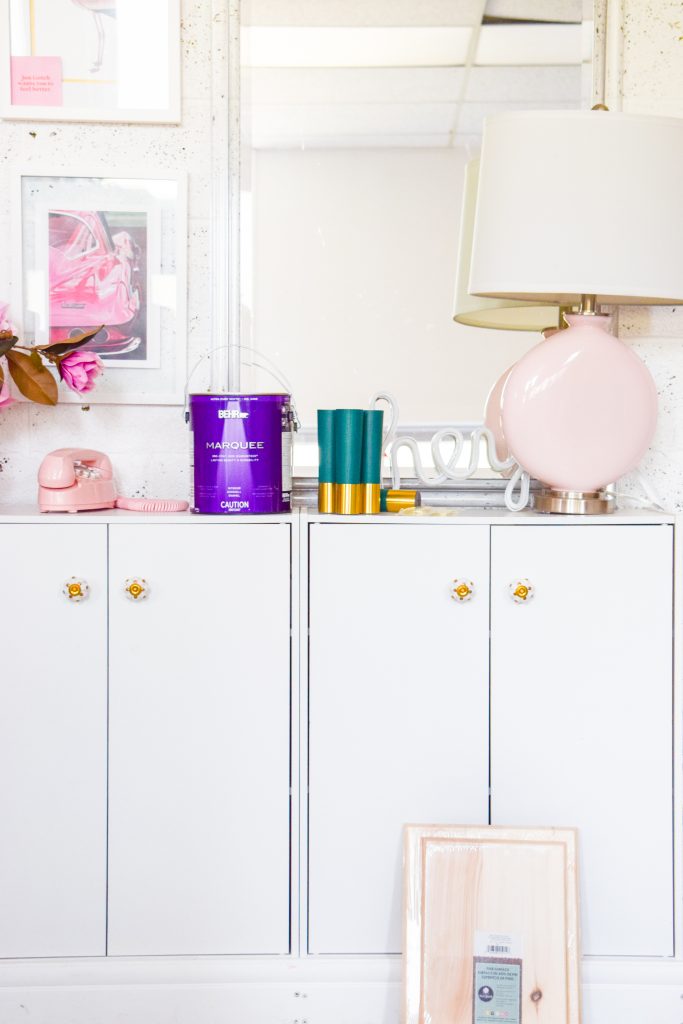 Create a Wes Anderson Inspired Entryway Console with a fresh coat of paint, new lamps, and Pretty Pegs. With these slick new Swedish mid century furniture legs + knobs, you can re-format any piece, while the new Color Plus lamps are the perfect shade for the space. 