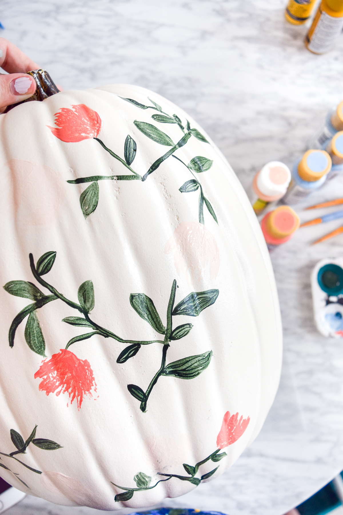 process shot of a floral painted pumpkins